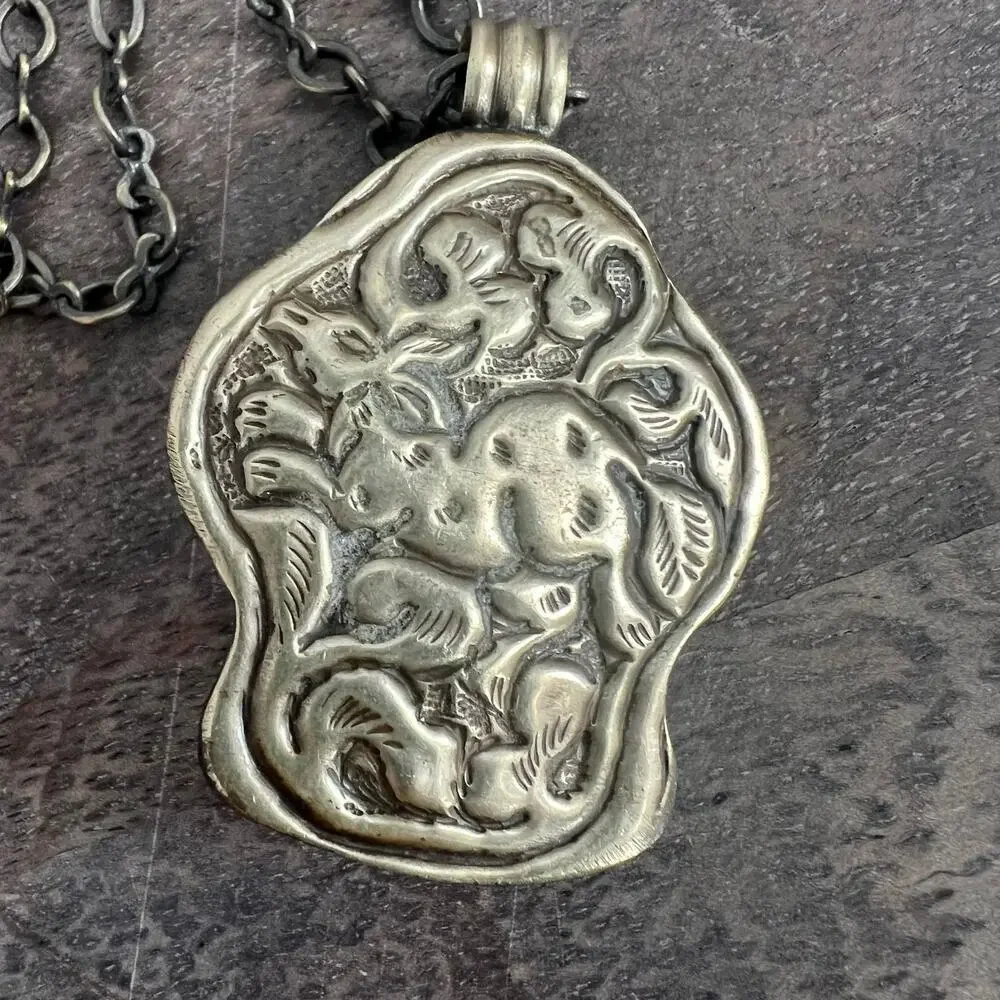 Vintage silver pendant necklace with turquoise stone - intricate animal design